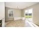 Cozy dining area with tile floors, built-in bench seating, and sliding glass doors leading to the backyard at 13398 N Largo Ct, Camby, IN 46113