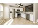 Modern kitchen with stainless steel appliances and white cabinets at 13398 N Largo Ct, Camby, IN 46113