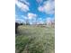 Spacious backyard with grassy area, providing ample outdoor space at 134 President W Trl, Indianapolis, IN 46229