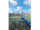 Backyard with grassy area and playset at 134 President W Trl, Indianapolis, IN 46229