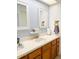 Updated bathroom with double vanity and stylish mirrors at 134 President W Trl, Indianapolis, IN 46229