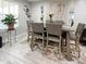 Bright dining room featuring a large table and six chairs at 134 President W Trl, Indianapolis, IN 46229