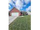 Brick ranch home with attached garage and well-maintained lawn at 134 President W Trl, Indianapolis, IN 46229