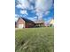 Brick ranch home with attached garage and spacious lawn at 134 President W Trl, Indianapolis, IN 46229
