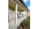 Covered front porch with rocking chairs and landscaping at 134 President W Trl, Indianapolis, IN 46229