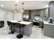 Modern kitchen with gray cabinets, stainless steel appliances, and an island at 134 President W Trl, Indianapolis, IN 46229
