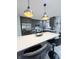 Modern kitchen with gray cabinets, stainless steel appliances, and an island at 134 President W Trl, Indianapolis, IN 46229