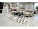 Spacious living room with sectional sofa and large rug at 134 President W Trl, Indianapolis, IN 46229