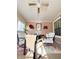Relaxing sunroom with seating area and ceiling fan at 134 President W Trl, Indianapolis, IN 46229