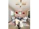 Relaxing sunroom with seating area and ceiling fan at 134 President W Trl, Indianapolis, IN 46229