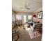 Relaxing sunroom with seating area and ceiling fan at 134 President W Trl, Indianapolis, IN 46229