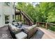 Spacious outdoor living area features stylish wicker furniture, a grill, and a staircase to the upper level at 14565 Geist Ridge Dr, Fishers, IN 46040