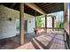 Relax on the back porch swing overlooking a tranquil backyard at 14565 Geist Ridge Dr, Fishers, IN 46040