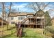 Sprawling multi-level backyard featuring wooden decks and stairs at 14565 Geist Ridge Dr, Fishers, IN 46040