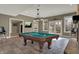 Finished basement rec room with a vintage-style pool table and neutral color palette at 14565 Geist Ridge Dr, Fishers, IN 46040