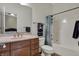 Well-maintained bathroom with a vanity, toilet, and shower-tub combination featuring modern fixtures and hardware at 14565 Geist Ridge Dr, Fishers, IN 46040