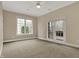 Spacious bedroom features a ceiling fan, neutral tones, and double doors to a deck at 14565 Geist Ridge Dr, Fishers, IN 46040