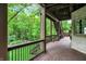 Exterior deck featuring stairs and a railing with natural shade coverage and greenery at 14565 Geist Ridge Dr, Fishers, IN 46040