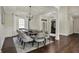 Elegant dining room featuring a large table, stylish chairs, and modern lighting fixtures at 14565 Geist Ridge Dr, Fishers, IN 46040
