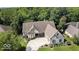 Stunning two-story home with an expansive driveway, lush landscaping, and impeccable exterior finishes at 14565 Geist Ridge Dr, Fishers, IN 46040