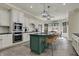 Bright kitchen with stainless steel appliances, granite countertops, and an island with seating at 14565 Geist Ridge Dr, Fishers, IN 46040
