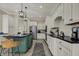 A well lit kitchen featuring a large island with bar seating and white cabinets at 14565 Geist Ridge Dr, Fishers, IN 46040