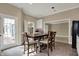 Inviting kitchen area with a dining table and access to the outdoor deck and staircase at 14565 Geist Ridge Dr, Fishers, IN 46040