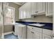 Functional laundry room with ample cabinet space, a sink, and modern appliances, making chores a breeze at 14565 Geist Ridge Dr, Fishers, IN 46040
