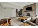 Spacious living room featuring a cozy brick fireplace, soft carpet, and stylish wooden accents at 14565 Geist Ridge Dr, Fishers, IN 46040
