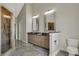 Main bathroom features double vanities, a glass door shower, and granite countertops at 14565 Geist Ridge Dr, Fishers, IN 46040
