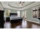 Spacious main bedroom with tray ceiling, hardwood floors, and large windows at 14565 Geist Ridge Dr, Fishers, IN 46040