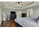 Relaxing main bedroom with a dresser, chair, floor mirror, and light green walls at 14565 Geist Ridge Dr, Fishers, IN 46040