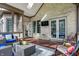 The patio features cozy seating, outdoor dining space, and access to both the sunroom and backyard at 14565 Geist Ridge Dr, Fishers, IN 46040