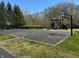 Community basketball court next to a ' playground on a sunny day at 14565 Geist Ridge Dr, Fishers, IN 46040