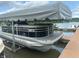 View of a Bennington pontoon boat docked on the water at 14565 Geist Ridge Dr, Fishers, IN 46040