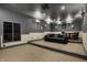 Home theater featuring tiered seating, recessed lighting, and a comfortable seating area at 14565 Geist Ridge Dr, Fishers, IN 46040