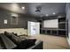 Home theater with a large projection screen and comfortable sofa for an immersive viewing experience at 14565 Geist Ridge Dr, Fishers, IN 46040
