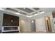 Living room with modern fireplace and coffered ceiling at 2212 Galleone Way, Plainfield, IN 46168