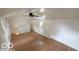 Finished attic featuring vaulted ceilings, wood floors, natural light, and a ceiling fan at 252 Ringwood Way, Anderson, IN 46013