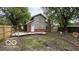 Spacious backyard featuring a wooden deck, partial fencing, and plenty of room for outdoor activities at 252 Ringwood Way, Anderson, IN 46013