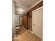 Small bathroom with toilet and built-in wooden cabinet at 252 Ringwood Way, Anderson, IN 46013