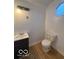 Simple bathroom with dark vanity and wood flooring at 252 Ringwood Way, Anderson, IN 46013