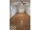 Spacious bonus room with hardwood floors and ceiling fan at 252 Ringwood Way, Anderson, IN 46013
