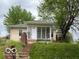 Charming home featuring a cozy enclosed porch and a welcoming entrance at 252 Ringwood Way, Anderson, IN 46013