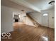 Living room with stone fireplace and wood flooring at 252 Ringwood Way, Anderson, IN 46013