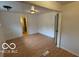 Spacious living room with new flooring, neutral paint, and updated lighting at 252 Ringwood Way, Anderson, IN 46013