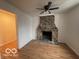 Living room with stone fireplace and hardwood floors at 252 Ringwood Way, Anderson, IN 46013
