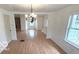 Open living room with hardwood floors, natural light, and an open floor plan, great for entertaining at 252 Ringwood Way, Anderson, IN 46013