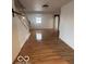 Bright living room with hardwood floors and staircase at 252 Ringwood Way, Anderson, IN 46013