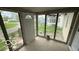 Bright sunroom with multiple windows offering natural light and views of the surrounding landscape at 252 Ringwood Way, Anderson, IN 46013